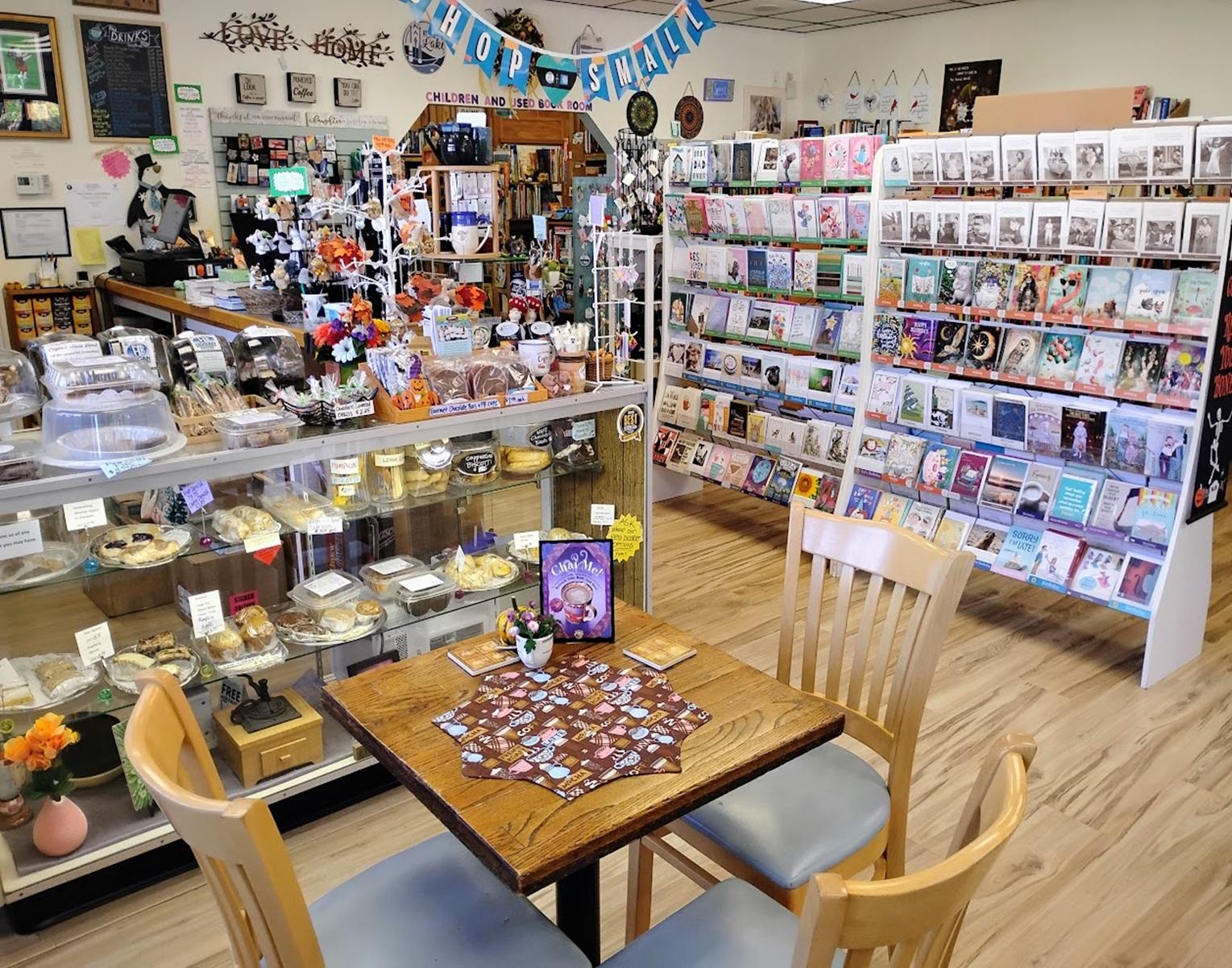 Inside Booklovers' Gourmet — café tables among the shelves